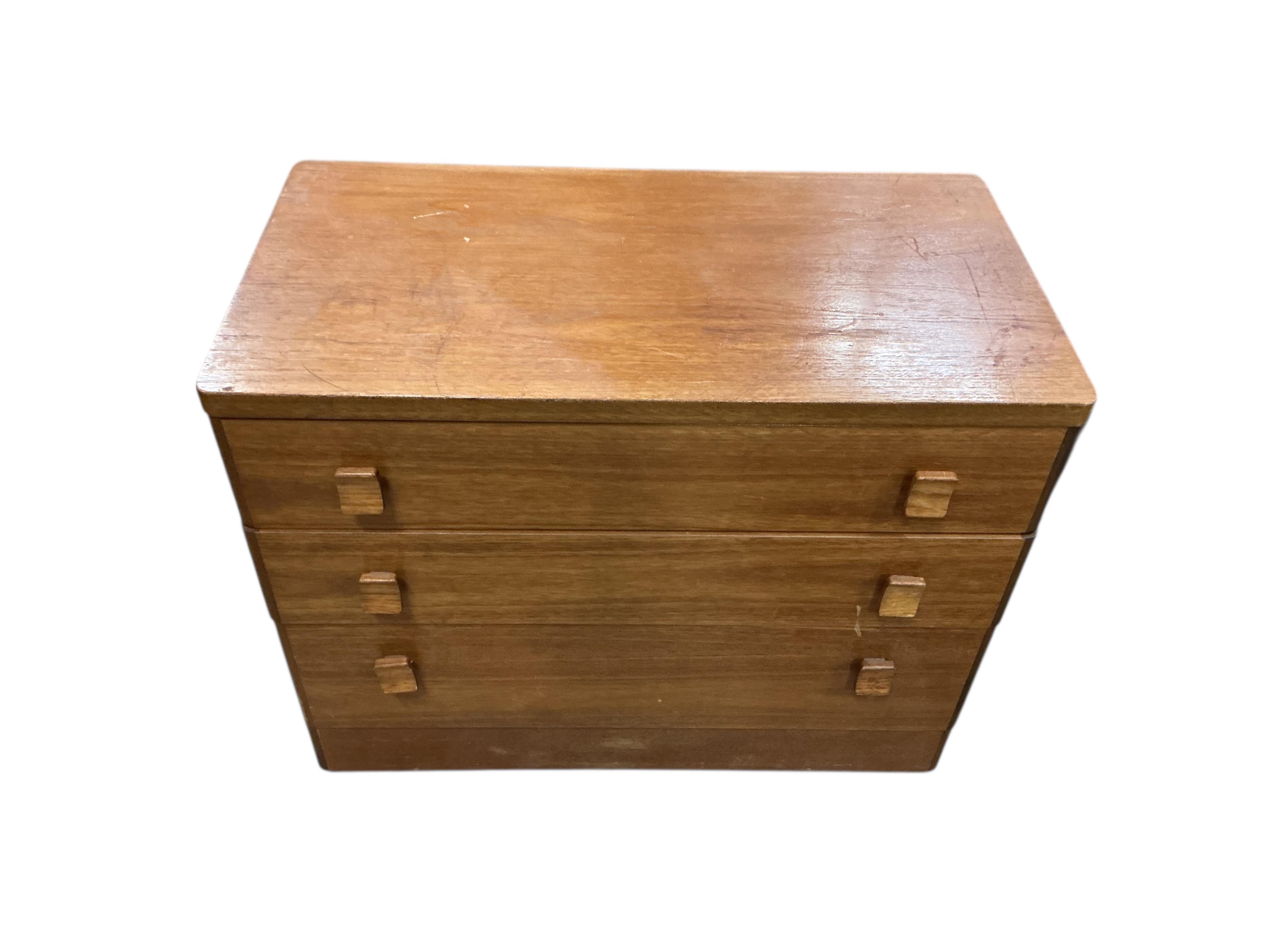 A small mid century Stag teak three drawer chest and a four drawer chest, larger width 80cm, depth 43cm, height 63cm